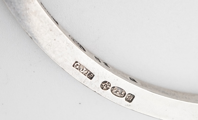 Georg Jensen, a bangle, circa 1964, and brooch, second half 20th century